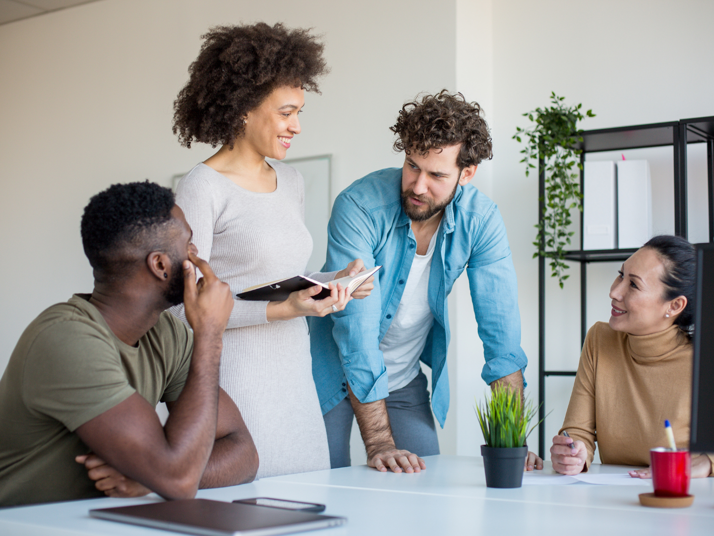 a private practice's administrative team discusses their business checking options with quaint oak bank