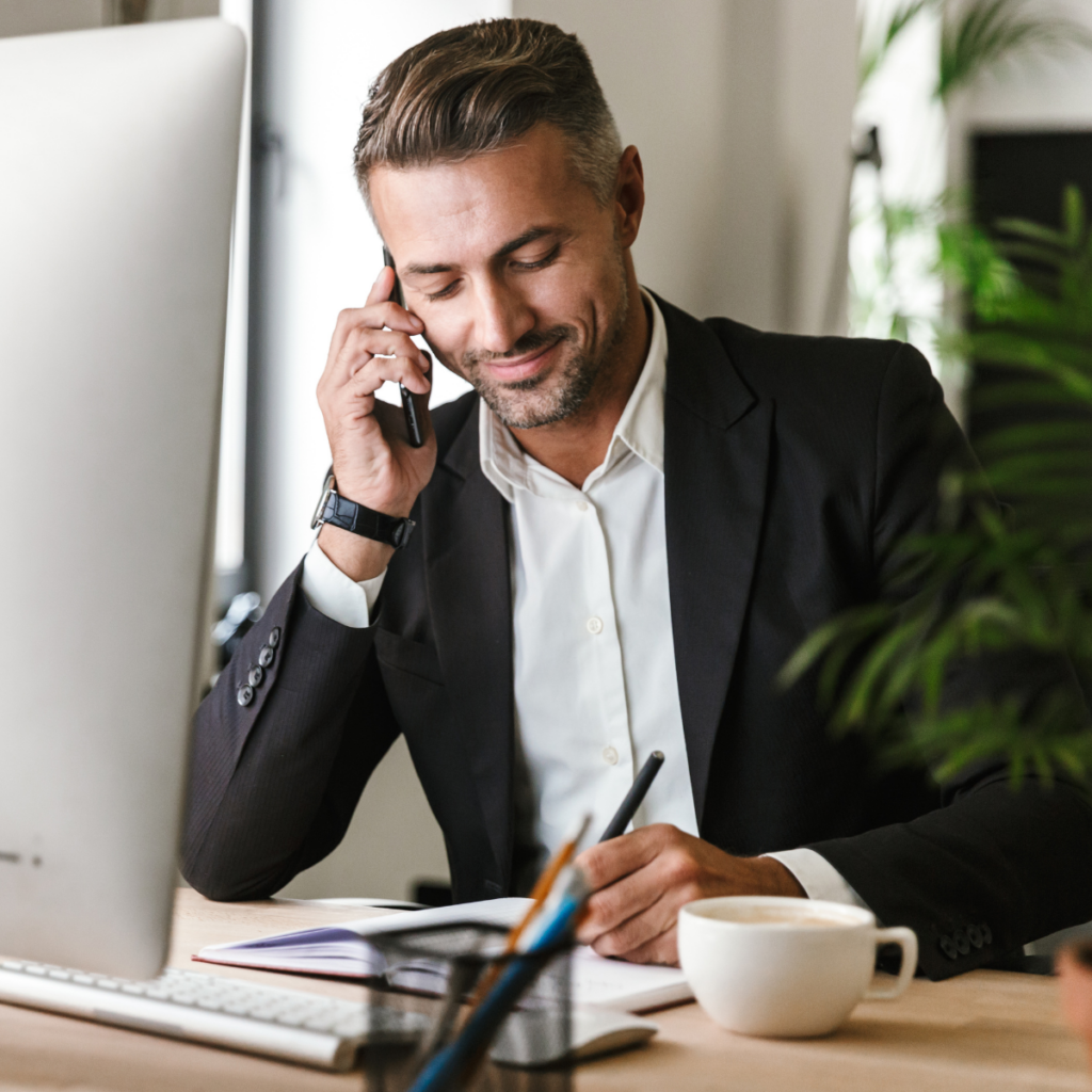 business owner reviewing their business checking options over the phone with his relationship manager